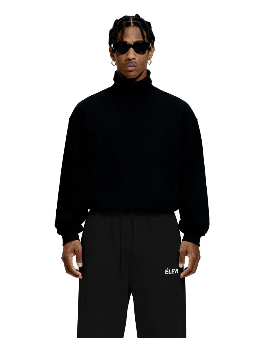 ÉLEVÉ schwarze Jogger Frontansicht – Premium Unisex Streetwear Jogginghose mit kleinem ÉLEVÉ Logo und weitem Bein